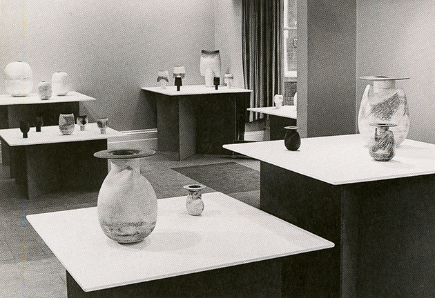 Caption:  The present shouldered bottle with flat circular lip on display at the exhibition at Midland Group Gallery, Nottingham, 1970 Photo: Photographer unknown.